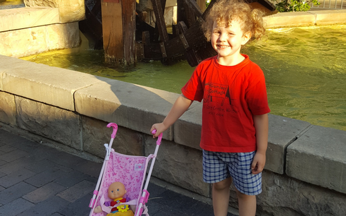 Kid at waterwheel