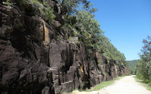 rock wall next to road