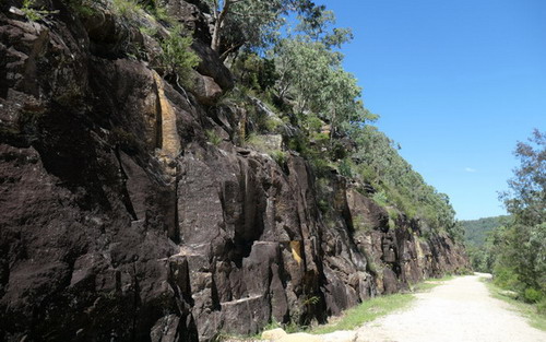 rock wall next to road