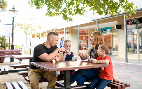 family at bench in Windsor Mall